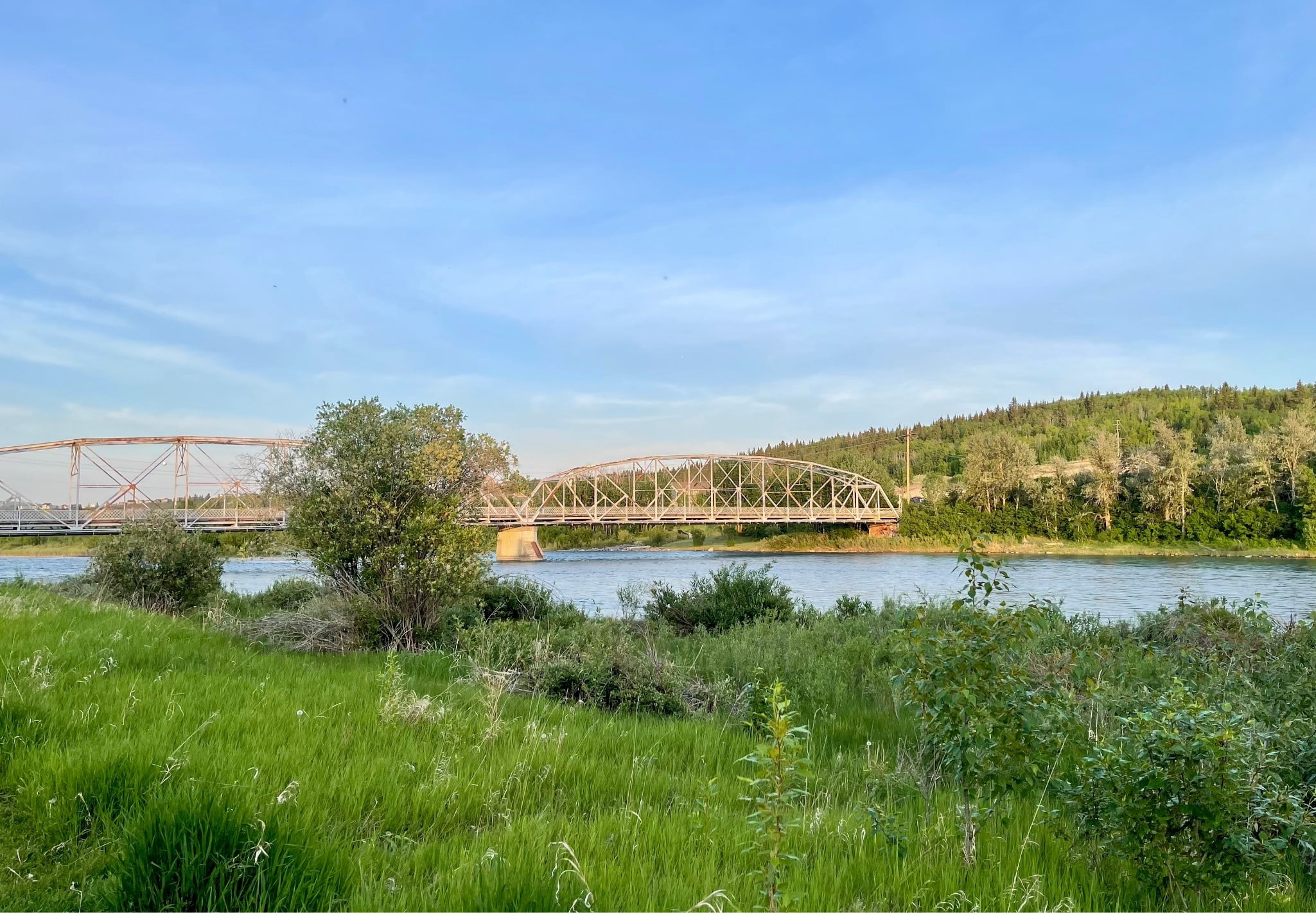 A picture of a river and a bridge going across that river.